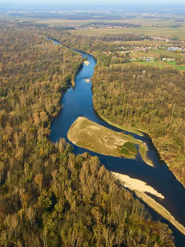 Aerial view of the River Mura with a town in the distance