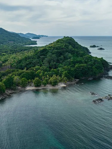 Aerial view of a mountainous coastal seascape of Sapzurro, Choco, Colombia