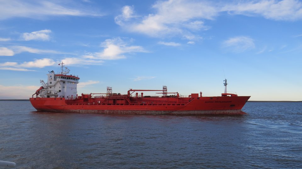 A red ship in Russian waters on a sunny day