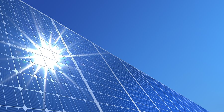 Solar panels reflect the sun on a bright day.