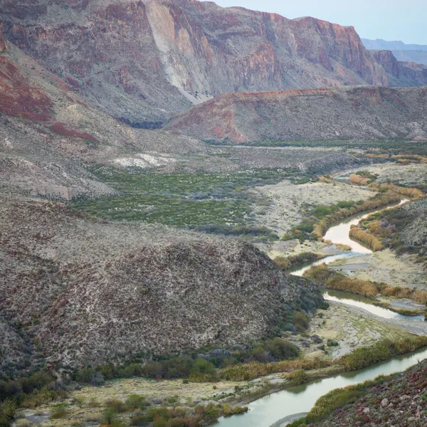 A river winds through a rocky canyon
