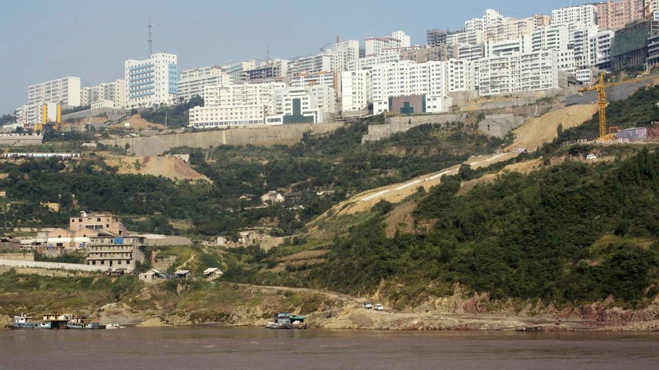 Three Gorges cities pulling down areas close to the river that will be flooded by the dam.