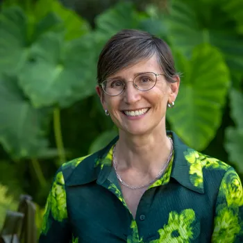 Toddi Steelman in fron tof green plants