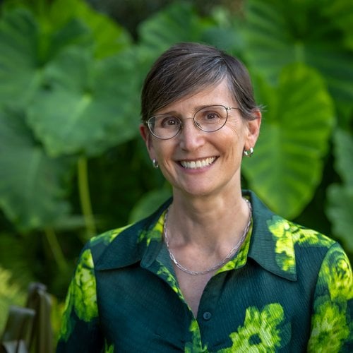 Toddi Steelman in fron tof green plants