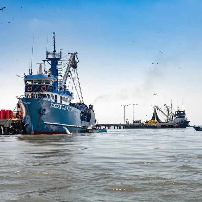 A tuna fishing boat docked in Ecuador on a sunny day