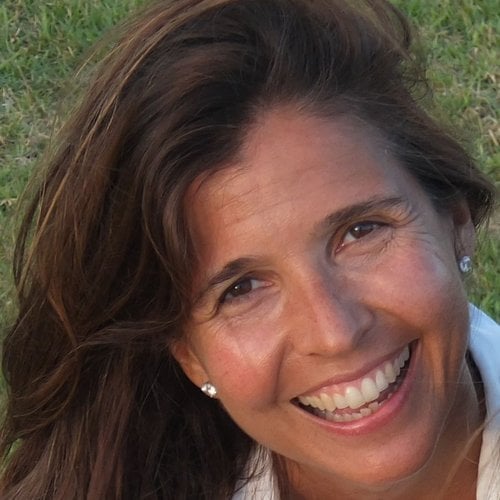 A headshot of a woman smiling at the camera