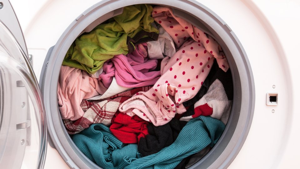 Washing machine full of clothes