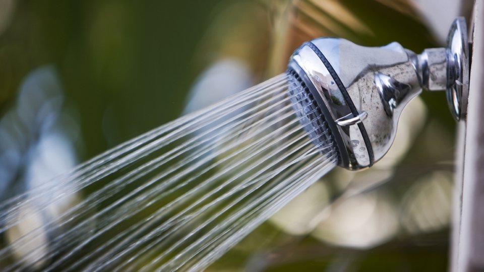 Water flowing from a shower head