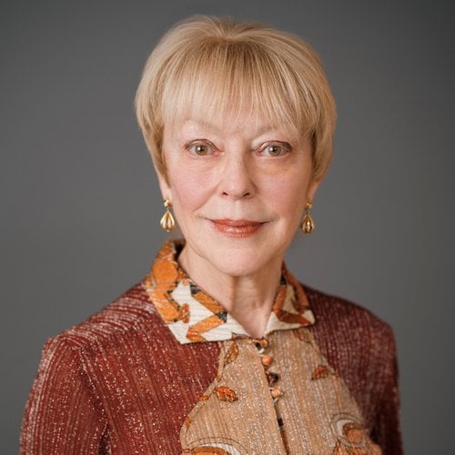 A headshot of a woman with a slight smile