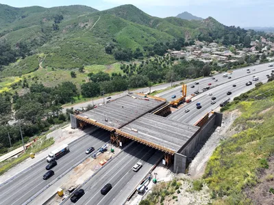 A highway wildlife crossing under construction