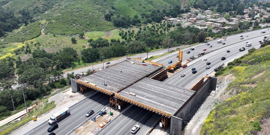 A highway wildlife crossing under construction