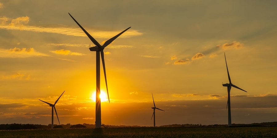 Wind turbines with a sunset in the background