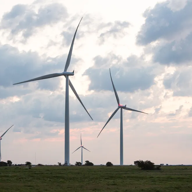 Several windmills against a morning sky