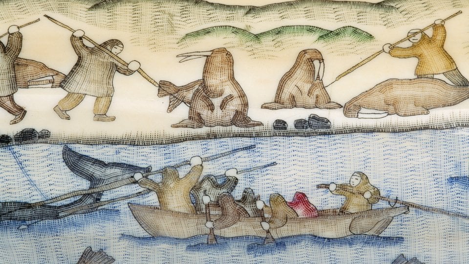 Carving in walrus tusk ivory, depicting walrus and whale hunters