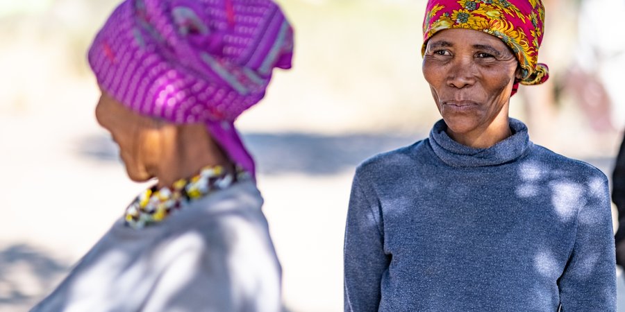 |uce Kxao stands outside in Nam Pan Village, Nyae Nyae Conservancy, Namibia
