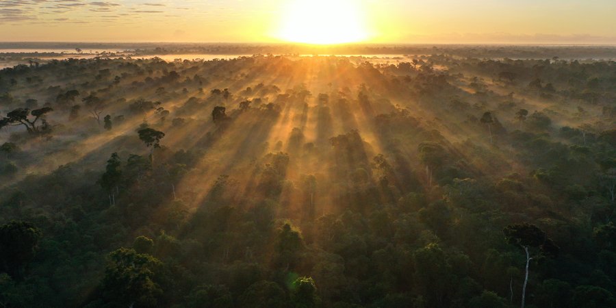 Color photo showing a sunset over a landscape in Brazil