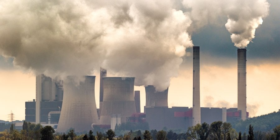 Smoke emitting from coal power plant stacks.