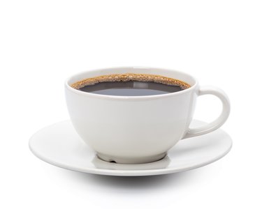 A cup of black coffee in a white cup and saucer