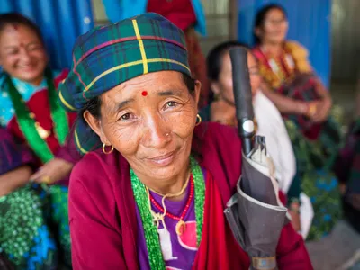 A community member attending the community meeting with Marcia Marsh, WWF-US Chief Operating Officer, held at the rebuilt Jivanjyoti Lower Secondary School in the Gorkha District of Nepal.
