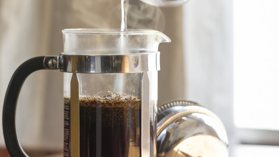 water pouring into a french press coffee maker