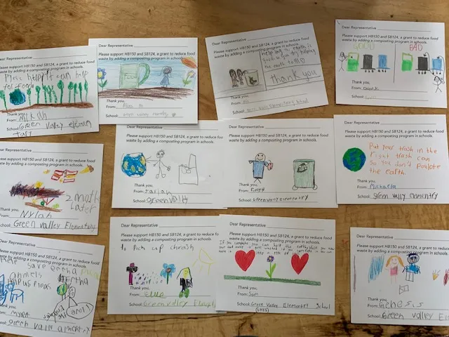 Overhead shot of handwritten postcards made by the MOCO food waste group.
