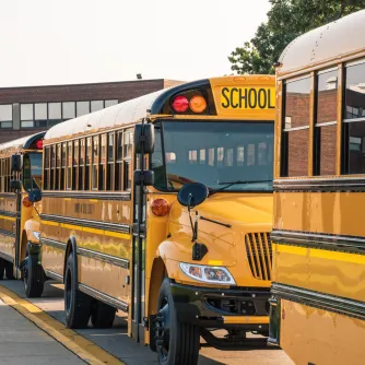 photo of school buses lined up on road