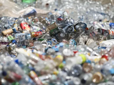 piles of plastic bottles in a landfill