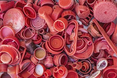 A pile of reddish-pink plastic waste.