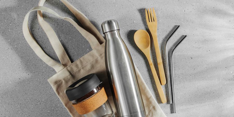 A collection of reusable bags, cups, cutlery