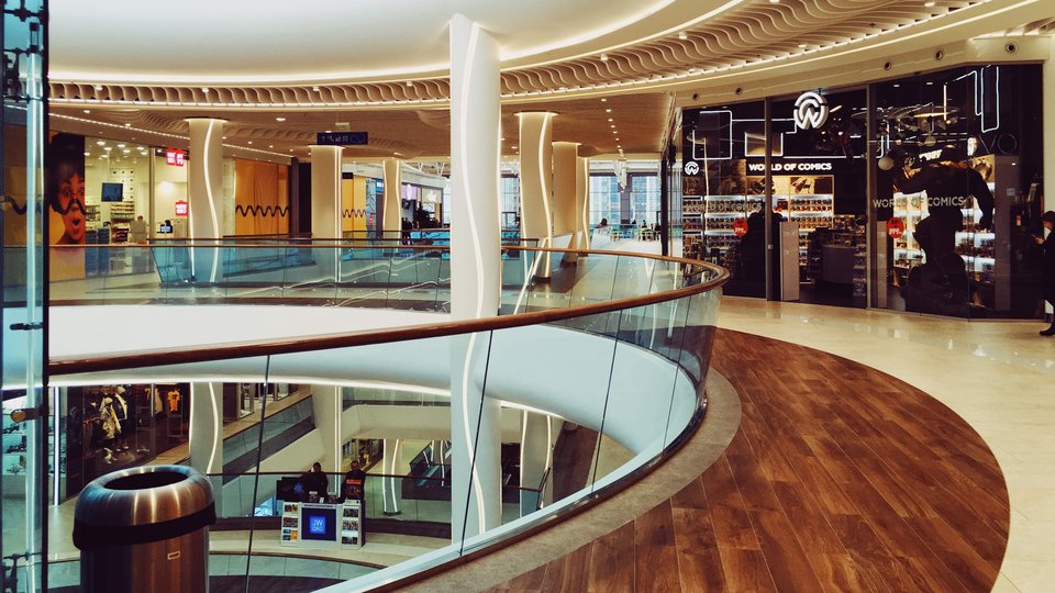 A view of inside a shopping mall looking out over all the levels in the shopping mall