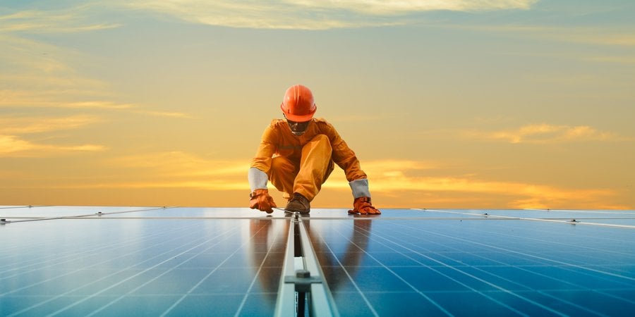 A man working at solar power station