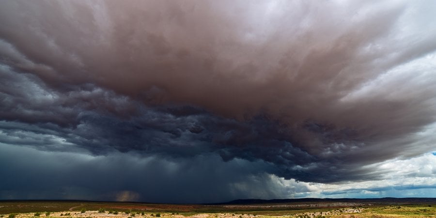 gatherine storm clouds over a field