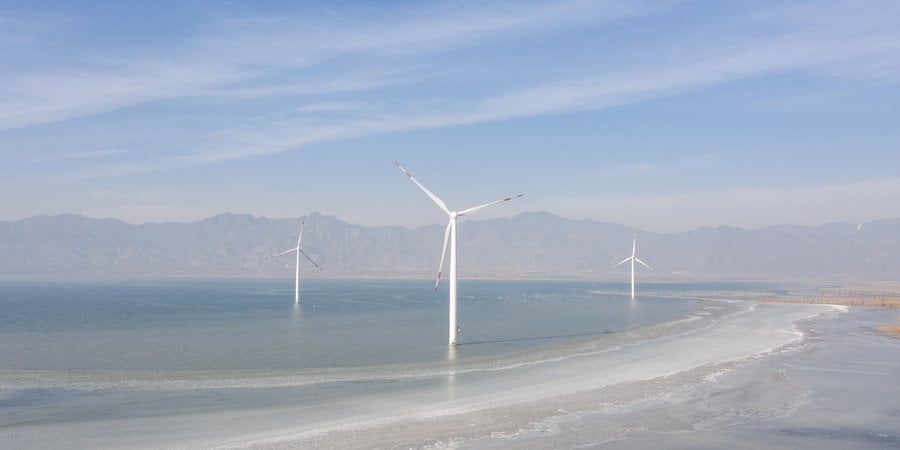 wind turbines under along a shoreline