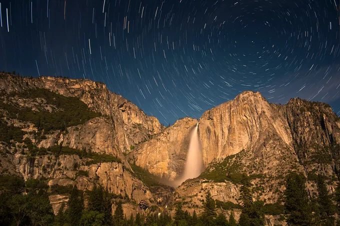 Photos of stars rotating above mountain